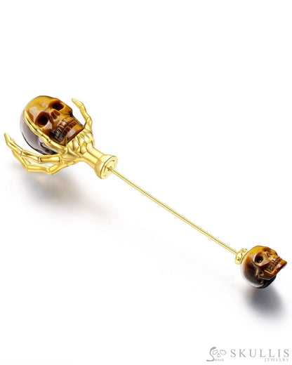 Gem Skull Brooch Of Gold Tiger’s Eye Carved Skull With Skeleton Hand In 18K Gold - Plated