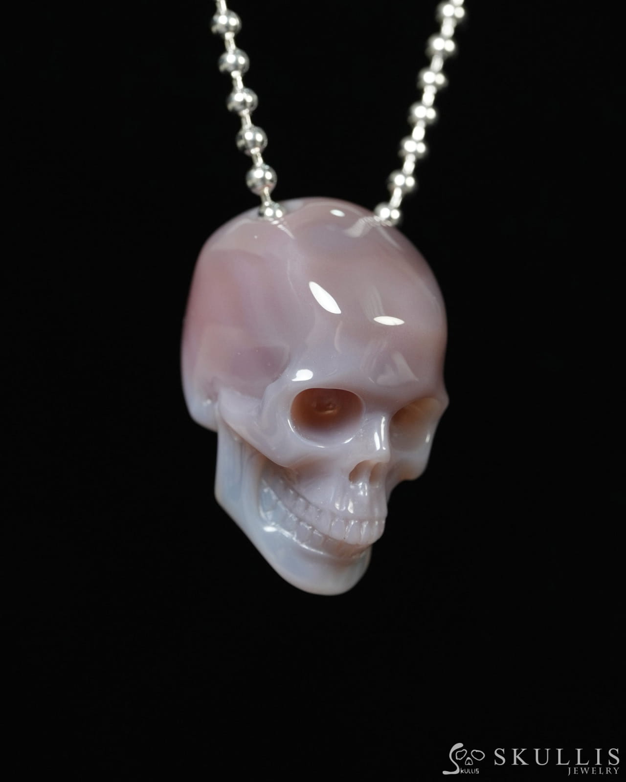 Hollow Essence - Gem Skull Pendant Necklace of Mozambique Agate